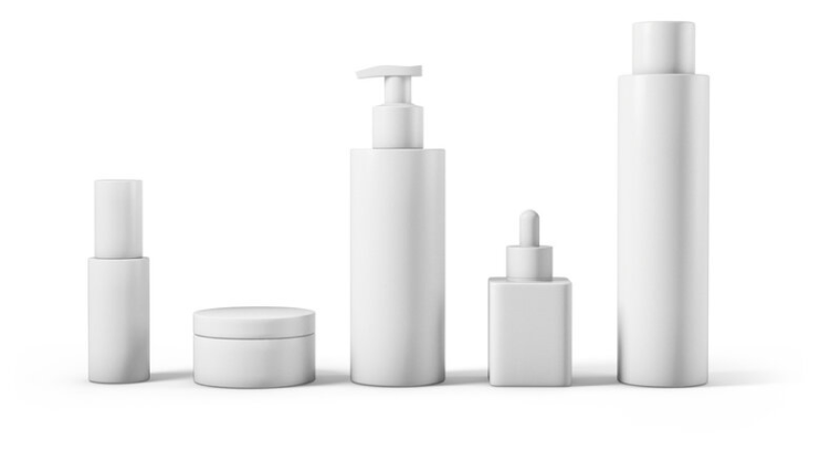A lineup of five minimalistic, unbranded white cosmetic containers on a white background, including a spray bottle, a jar, a pump bottle, a dropper bottle, and a tall cylindrical bottle