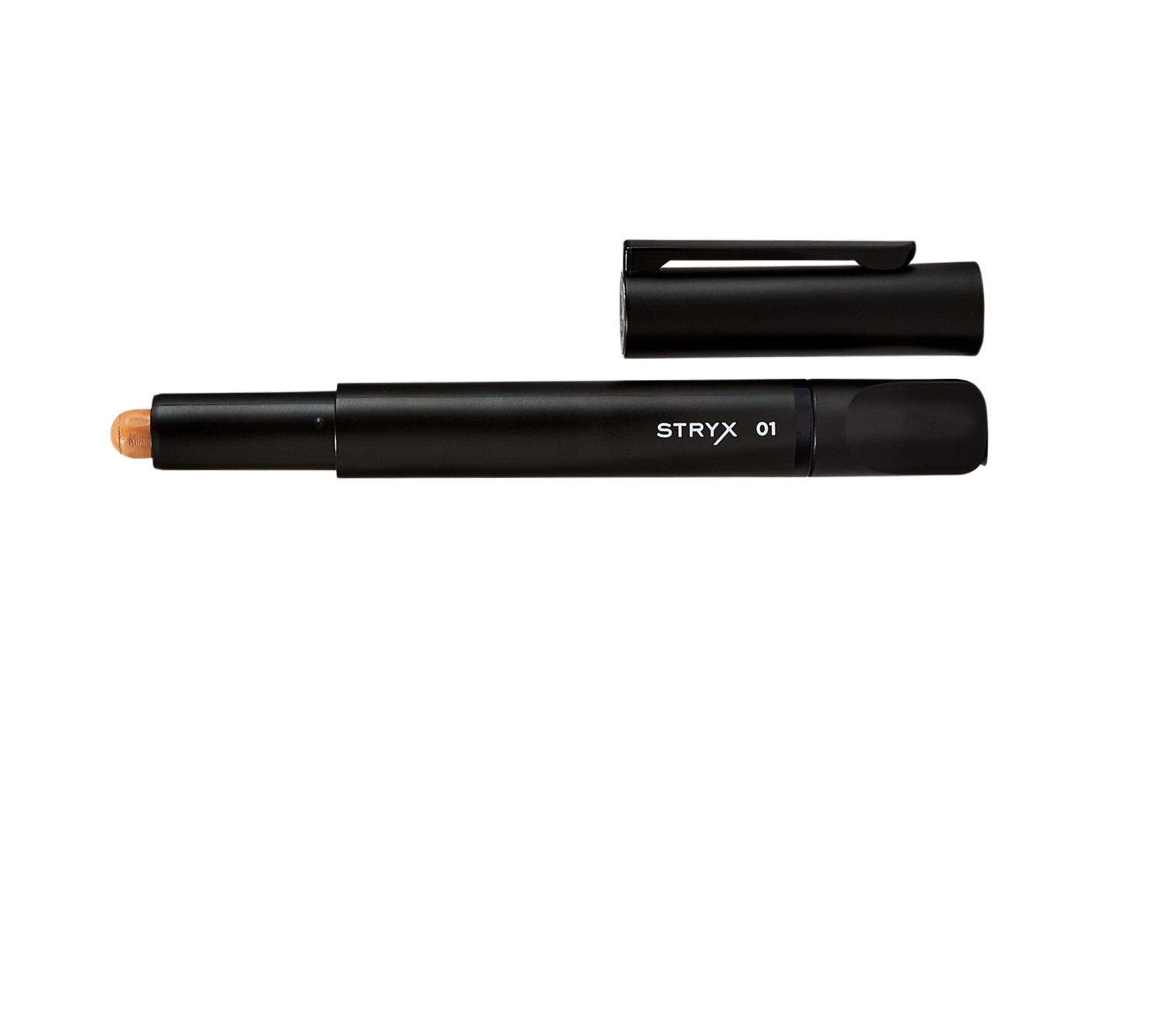 A black Stryx concealer stick with its cap removed, revealing a beige-tinted product tip, designed for men's skincare and grooming