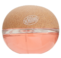 A DKNY Be Delicious perfume bottle with a round shape, featuring a cork-textured top and pink liquid inside the transparent bottom half
